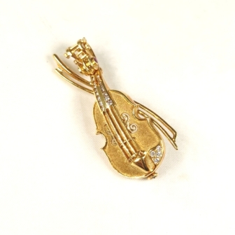 K21.6 ルビー(0.30ct)ダイヤモンド(0.15ct)付ブローチ