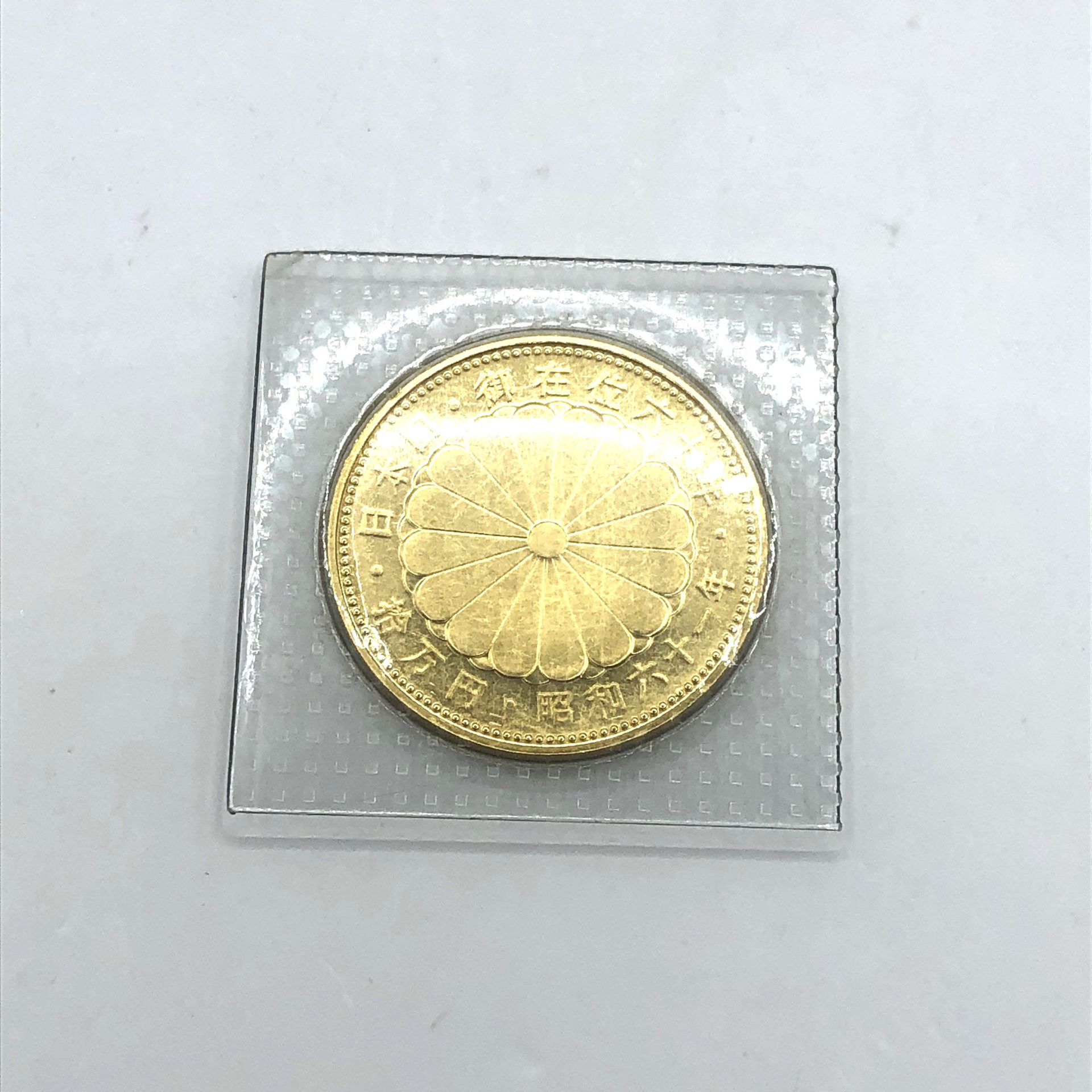 天皇陛下御在位60年記念10万円金貨